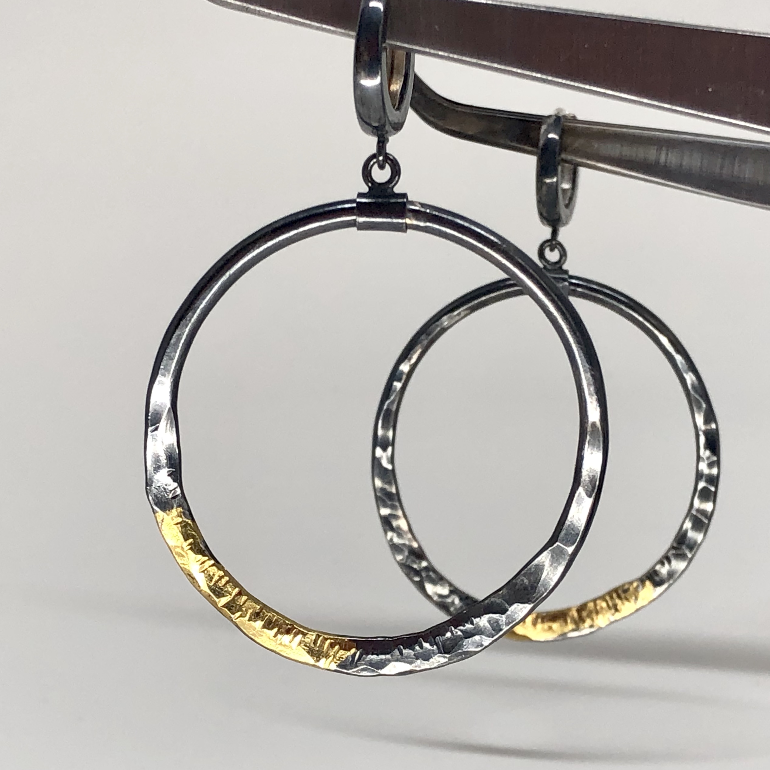 Sterling and gold hoop earrings